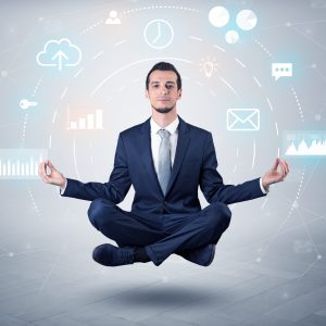 Elegant calm businessman levitates in yoga position with data circulation concept