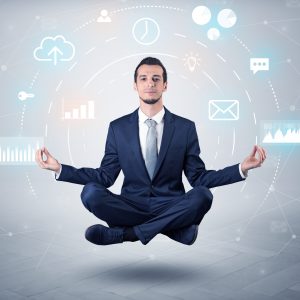 Businessman levitates with data circulation concept Elegant calm businessman levitates in yoga position with data circulation concept